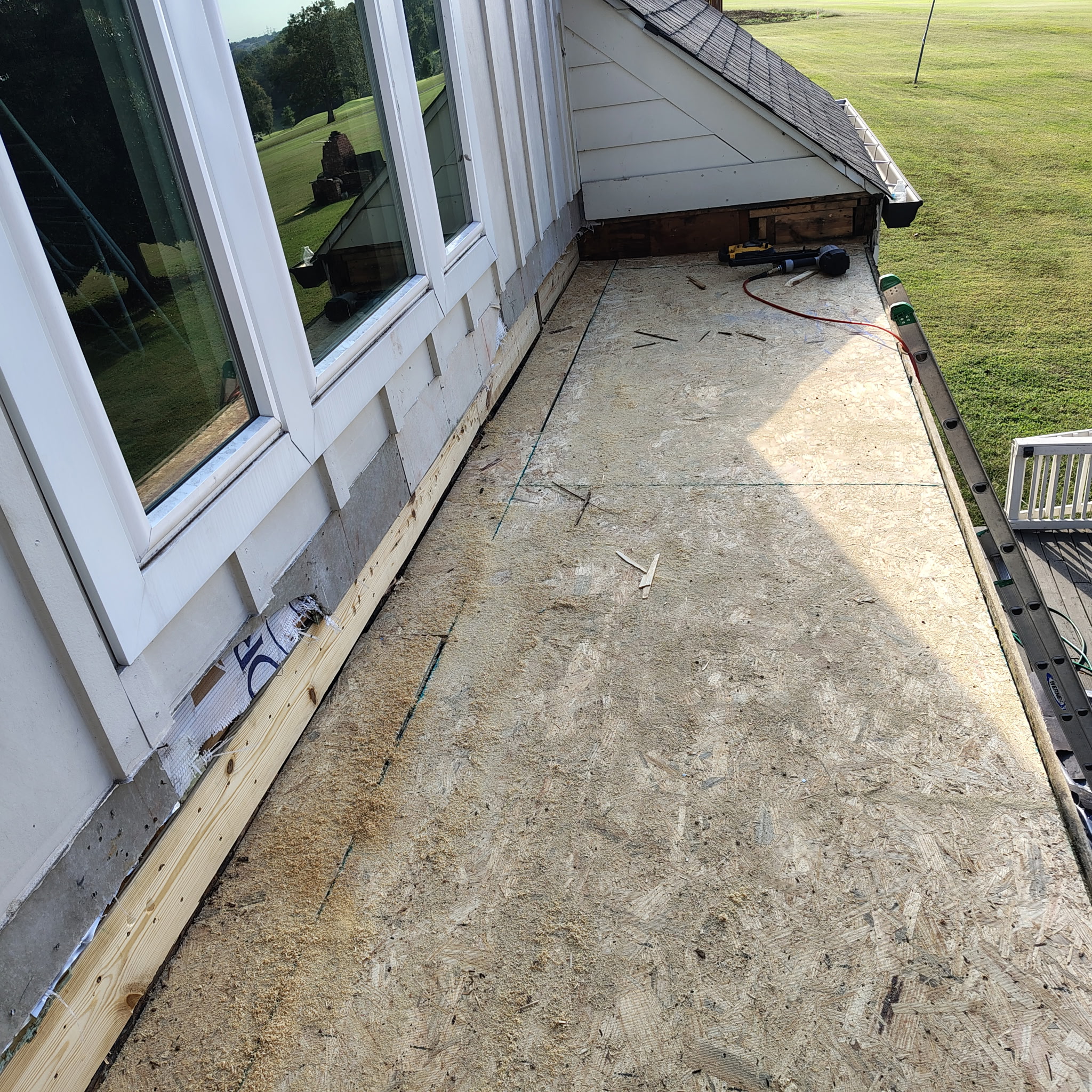 Rebuilding the Roof Before TPO Installation in Nashville New plywood roof decking installed after removing rotted materials on a flat roof deck in Nashville. The repaired surface is prepped for tapered insulation and TPO roofing to prevent future water damage.